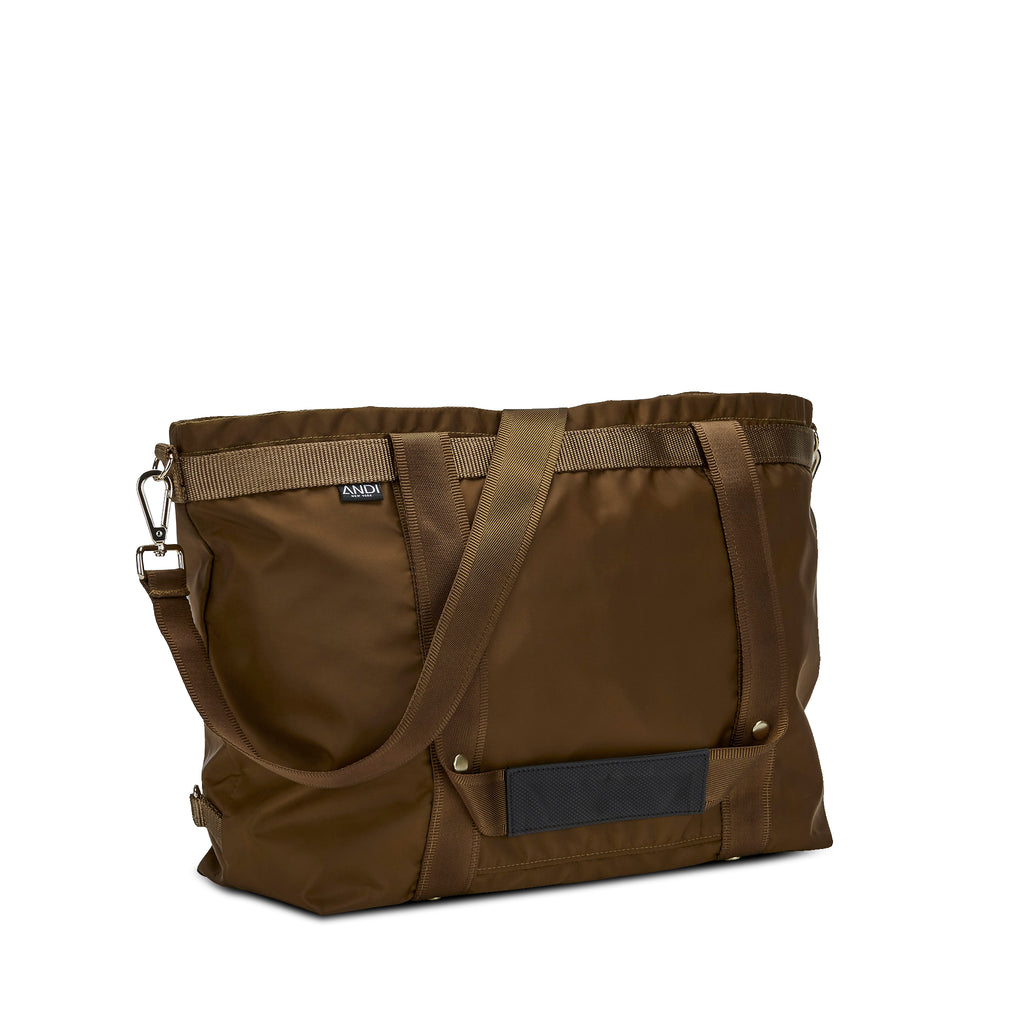 Lightweight Large ANDI cross-body travel tote in golden brown color that transforms to backpack