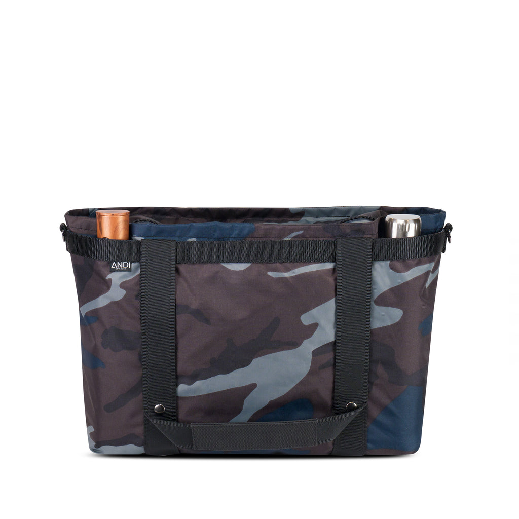 Umbrella and water bottle pockets outside ANDI Large water resistant travel tote in blue camo