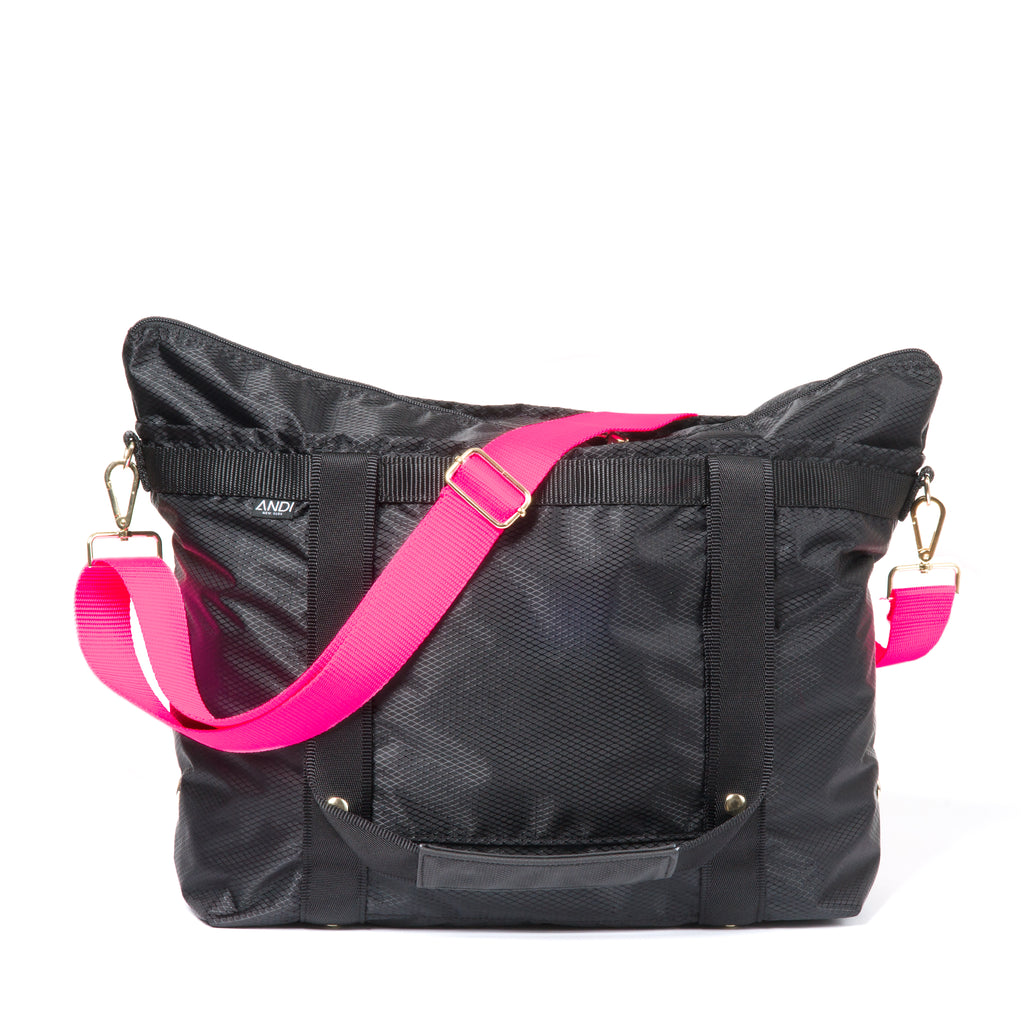 Hot pink nylon crossbody strap on black ANDI tote bag | Gold hardware