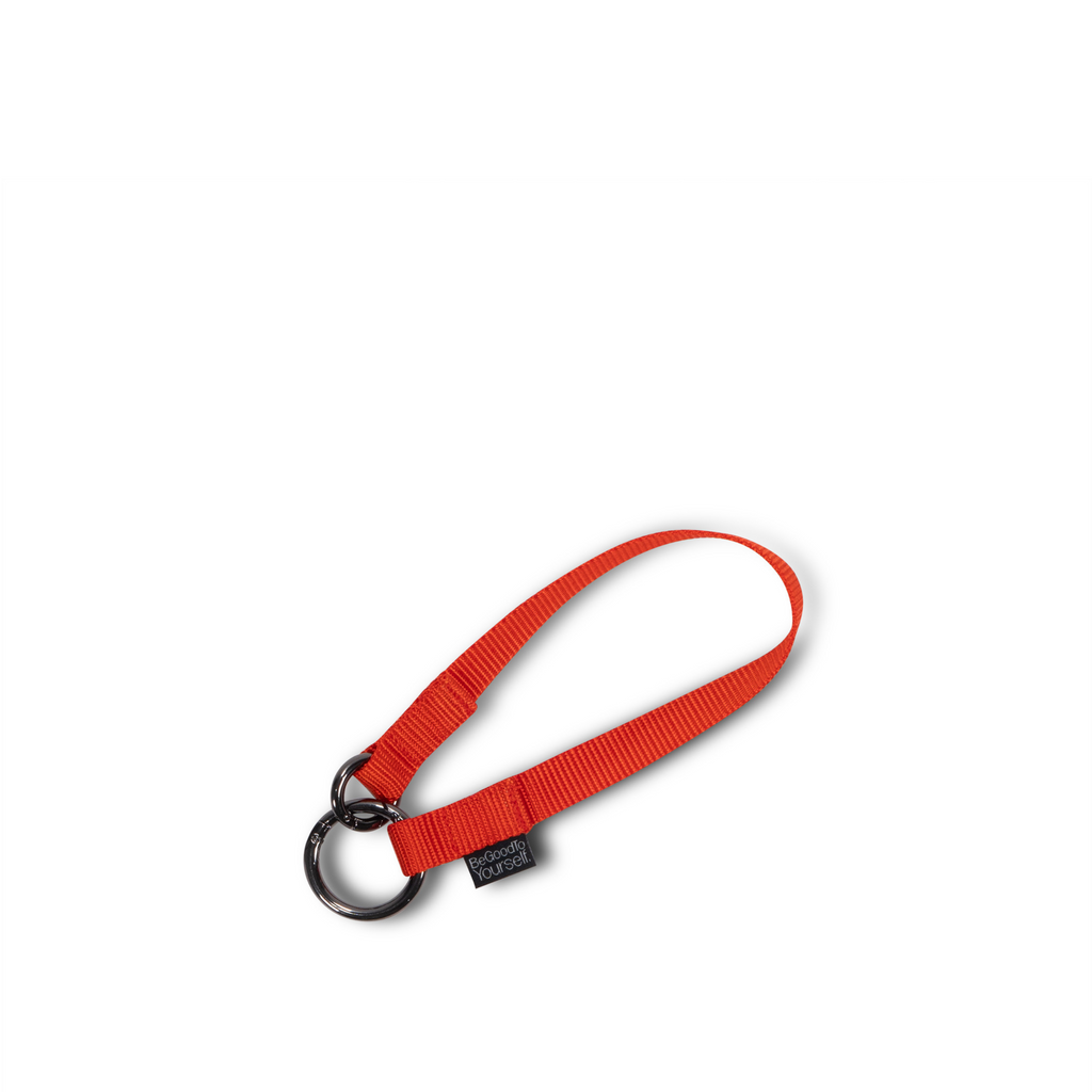 Small orange nylon strap with ring clips on both sides | ANDI key leash