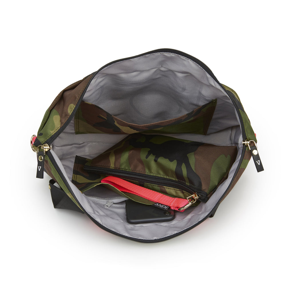 Inner pockets and snap-out wristlet clutch inside ANDI Small convertible crossbody tote | Camo