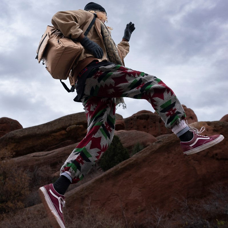 Metallic Rose Gold ANDI Backpack on a woman running at Red Rocks | Laptop Travel Bag